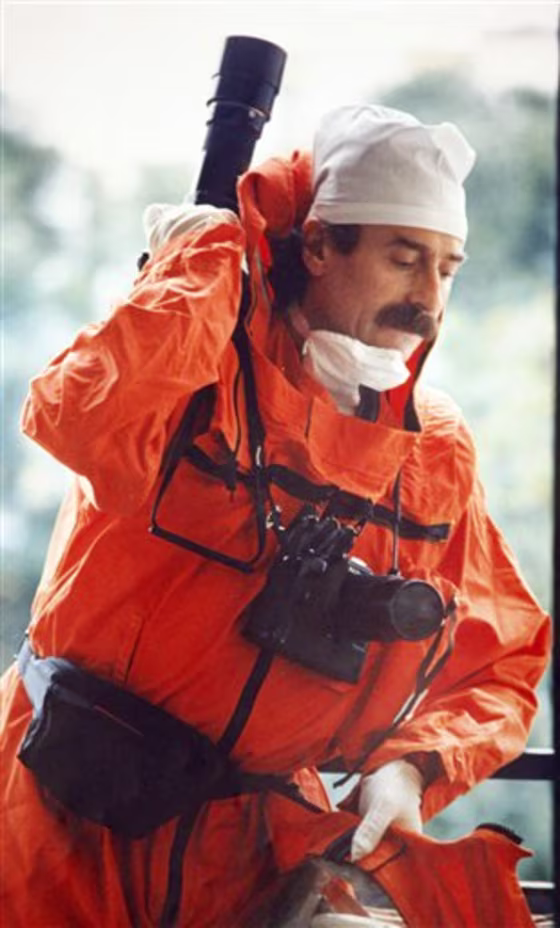 Igor Kostin taking photographs after the explosion in the 4th reactor of the Chernobyl nuclear power plant in 1986.&nbsp;Wearing a lead protective suit and placing his cameras in lead boxes, Kostin made a terrifying and unauthorized trip to the Chernobyl danger zone just a few days after a nuclear power plant reactor exploded in the world's worst atomic accident. He came back home with nothing to show for his determination to document the crisis — the radiation was so high that all his shots turned out black. 